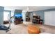 A bonus room features an elliptical, desk, TV, and vaulted ceilings at 3011 Oak Hampton Ct, Duluth, GA 30096
