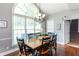 Formal dining area features an elegant chandelier and large bay window at 3011 Oak Hampton Ct, Duluth, GA 30096