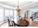 Traditional dining room with bay window, chandelier, and hardwood floors at 3011 Oak Hampton Ct, Duluth, GA 30096