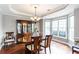 Formal dining room with wood floors, chandelier lighting, and a large bay window that provides plenty of natural light at 3011 Oak Hampton Ct, Duluth, GA 30096