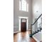 Grand foyer with high ceilings, hardwood floors, and staircase with white trim at 3011 Oak Hampton Ct, Duluth, GA 30096