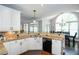 Charming kitchen with granite countertops, white cabinets, and stainless steel dishwasher at 3011 Oak Hampton Ct, Duluth, GA 30096