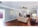 Spacious living room with hardwood flooring and a cozy brick fireplace at 3011 Oak Hampton Ct, Duluth, GA 30096