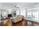 Bright living room with hardwood floors, fireplace, and access to the backyard at 3011 Oak Hampton Ct, Duluth, GA 30096
