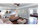 View of hardwood living room adjacent to kitchen and another living area at 3011 Oak Hampton Ct, Duluth, GA 30096