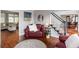 Bright living room with hardwood floors, and views to both the dining room and an adjacent living room at 3011 Oak Hampton Ct, Duluth, GA 30096