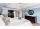A spacious main bedroom boasts a tray ceiling, and views to the main bathroom at 3011 Oak Hampton Ct, Duluth, GA 30096