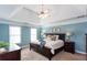 Inviting bedroom with a tray ceiling, neutral carpet, and coordinated decor at 3011 Oak Hampton Ct, Duluth, GA 30096