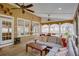 Relaxing outdoor patio features ceiling fans, comfortable seating, and a cozy ambiance at 3011 Oak Hampton Ct, Duluth, GA 30096