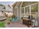 Outdoor patio featuring a grill, bench, and adjacent window with a view of the backyard at 3011 Oak Hampton Ct, Duluth, GA 30096