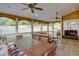 Spacious screened-in patio includes ceiling fans, a large table, and outdoor seating at 3011 Oak Hampton Ct, Duluth, GA 30096