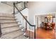 View of carpeted staircase leading to the second floor; hardwood floor visible at 3011 Oak Hampton Ct, Duluth, GA 30096