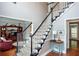 Beautiful staircase with neutral carpet, and black painted accents at 3011 Oak Hampton Ct, Duluth, GA 30096