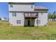 Exterior rear view of the home with a deck at 4357 James Wade Dr, Snellville, GA 30039
