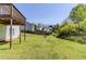 View of the home's backyard with green grass at 4357 James Wade Dr, Snellville, GA 30039