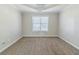 Bedroom with a window and neutral carpet at 4357 James Wade Dr, Snellville, GA 30039