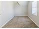 Bedroom featuring neutral carpet and a bright window at 4357 James Wade Dr, Snellville, GA 30039