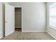 Bedroom featuring neutral carpet and a closet at 4357 James Wade Dr, Snellville, GA 30039