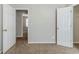 Bedroom featuring neutral carpet and several doors at 4357 James Wade Dr, Snellville, GA 30039
