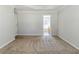 Spacious bedroom featuring trey ceiling and neutral carpet at 4357 James Wade Dr, Snellville, GA 30039