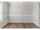 Dining room with new laminate floors, large window, and neutral paint at 4357 James Wade Dr, Snellville, GA 30039