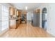 Bright kitchen featuring wood cabinets, stainless steel appliances, and tile backsplash at 4357 James Wade Dr, Snellville, GA 30039