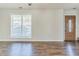 Bright living room with laminate floors, large window, and natural light at 4357 James Wade Dr, Snellville, GA 30039