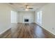 Living room with fireplace, laminate floors and neutral colored walls at 4357 James Wade Dr, Snellville, GA 30039