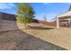 The backyard features a fenced-in yard with a covered patio and fresh landscaping at 81 Creekside Bluff Way, Auburn, GA 30011
