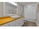 Elegant bathroom with a modern vanity, vessel sink, and shower with curtain at 81 Creekside Bluff Way, Auburn, GA 30011