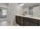 Stylish bathroom with double sinks, modern fixtures, and ample counter space at 81 Creekside Bluff Way, Auburn, GA 30011