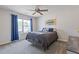 Inviting bedroom with a ceiling fan, natural light, and calming decor at 81 Creekside Bluff Way, Auburn, GA 30011