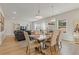 Open-concept dining area with stylish furniture and a cozy living space at 81 Creekside Bluff Way, Auburn, GA 30011