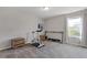 Bright exercise room featuring an exercise bike, weights, and natural light at 81 Creekside Bluff Way, Auburn, GA 30011