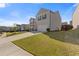 Beautiful home with a well-maintained lawn and a two-car attached garage at 81 Creekside Bluff Way, Auburn, GA 30011