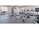 Bright community gym featuring treadmills, elliptical machines, and weightlifting equipment for residents' fitness needs at 81 Creekside Bluff Way, Auburn, GA 30011