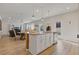 Open kitchen featuring an island with granite countertops and stainless steel appliances at 81 Creekside Bluff Way, Auburn, GA 30011