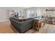 Comfortable living room featuring a large sectional couch and stylish decor at 81 Creekside Bluff Way, Auburn, GA 30011