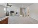 Upstairs living room with large carpeted area and natural light at 81 Creekside Bluff Way, Auburn, GA 30011