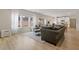 Bright and airy living room with a large sectional couch and an open layout at 81 Creekside Bluff Way, Auburn, GA 30011