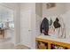 Cozy mudroom with built-in storage and a bench for convenience at 81 Creekside Bluff Way, Auburn, GA 30011