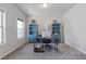 Bright and functional office space with blue bookshelves and natural light at 81 Creekside Bluff Way, Auburn, GA 30011