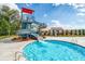 Community pool featuring a water slide and various other amenities for residents to enjoy at 81 Creekside Bluff Way, Auburn, GA 30011