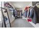 Spacious walk-in closet with ample storage and a full-length mirror at 81 Creekside Bluff Way, Auburn, GA 30011