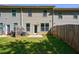 Fenced backyard featuring a lawn, patio and mature trees for privacy and outdoor enjoyment at 8475 Douglass Trl, Jonesboro, GA 30236
