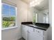 Bathroom features granite vanity, a large mirror, white cabinets and a large window at 8475 Douglass Trl, Jonesboro, GA 30236
