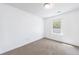 Bedroom with carpet flooring and a window providing natural light at 8475 Douglass Trl, Jonesboro, GA 30236