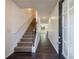Welcoming entryway with hardwood floors, a staircase leading to the upper level, and ample natural light at 8475 Douglass Trl, Jonesboro, GA 30236
