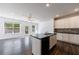 Modern kitchen with an island, stainless steel appliances, granite countertops, and ample cabinet space at 8475 Douglass Trl, Jonesboro, GA 30236