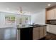 Bright kitchen featuring a central island, stainless steel appliances, and an open layout at 8475 Douglass Trl, Jonesboro, GA 30236